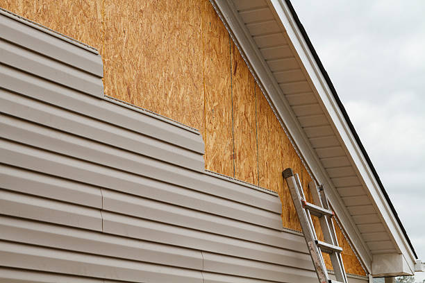 Professional Storm Damage Siding Repair technician working in Wedgefield, SC